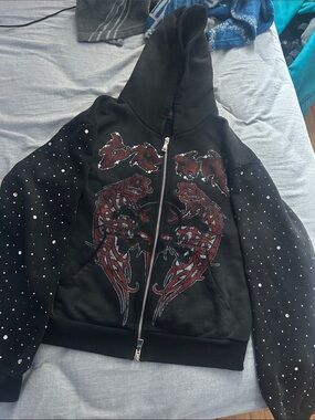 Black Zip-Up Hoodie with Red Graphic and Stud Detailing